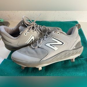 New Balance metal cleats